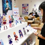 Custom acrylic standees displayed in a vibrant retail showroom for fans and collectors.