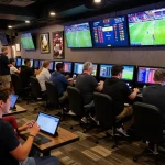 Engaged bettors placing bets on keonhacai sports betting, dynamic screens behind them displaying live odds and games